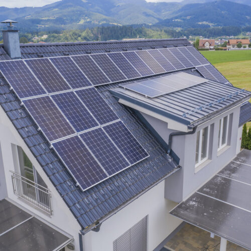 aerial view private house with solar panels roof